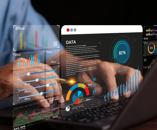Data analyst working on business analytics dashboard with charts, with KPI and metrics connected to the database for technology finance, operations, sales, marketing